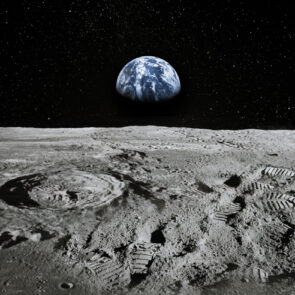 Surface of the Moon With the Earth Rising in the Horizon