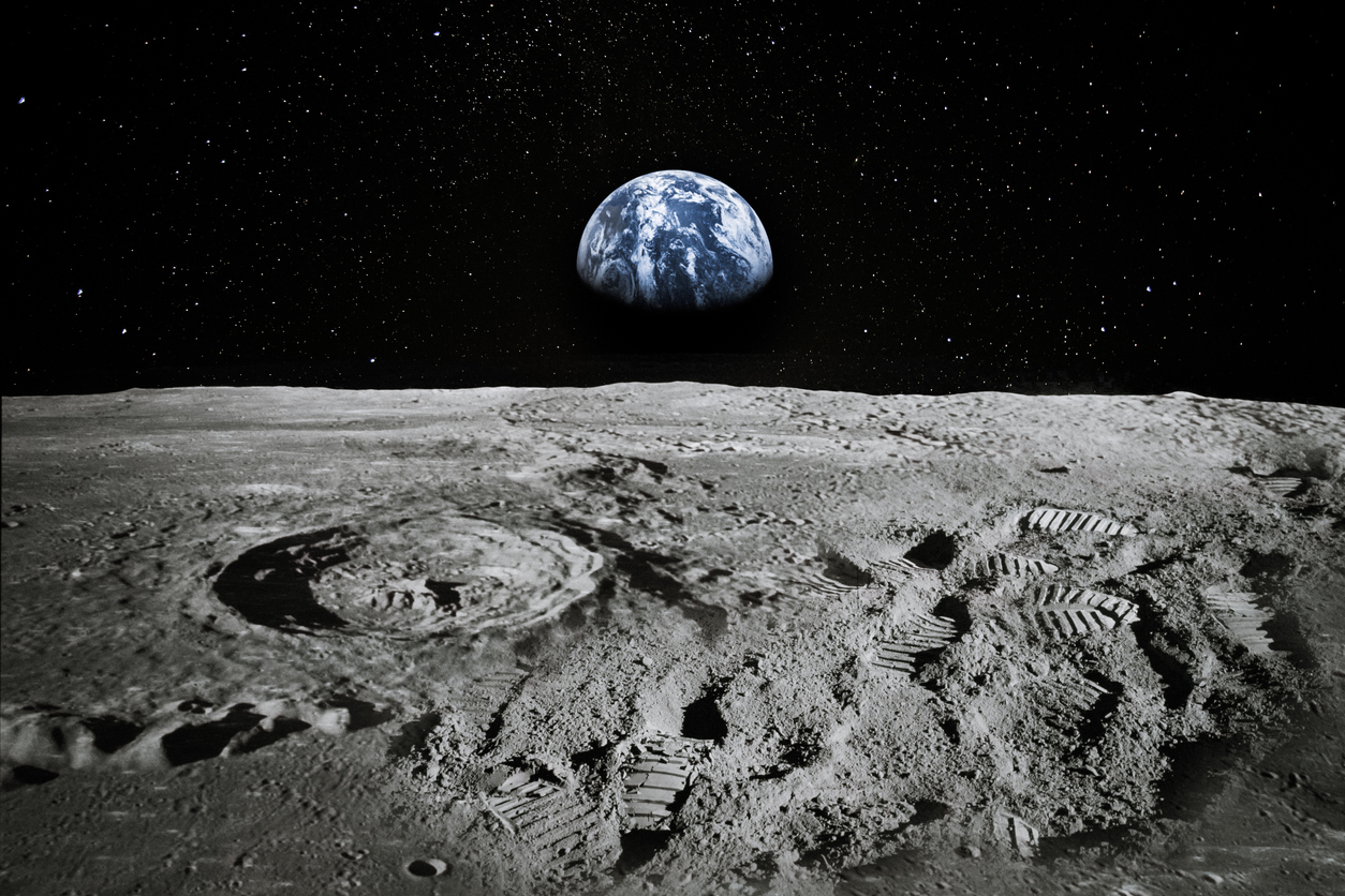Surface of the Moon With the Earth Rising in the Horizon